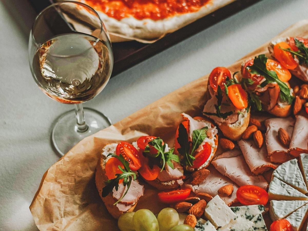 Aperitif appetizers and a glass of wine