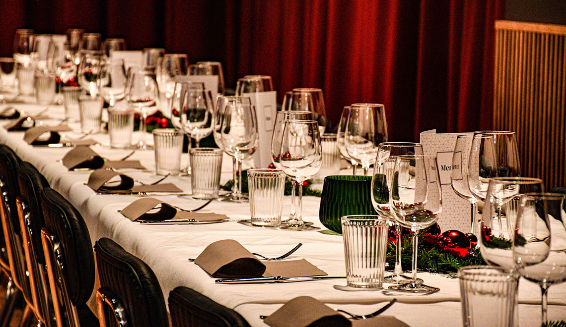 A row of tables set for Christmas dinner at the Westhive Zurich Hardturm